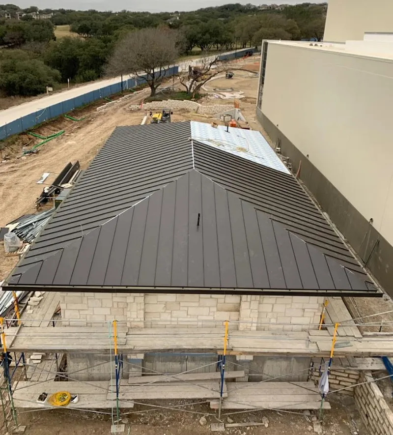 Metal roof new construction with scaffolding in Seaside